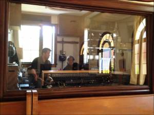 Looking in at The Stikman and assistant engineer Tristan Baccus at the Board in the control room at Polymorph.